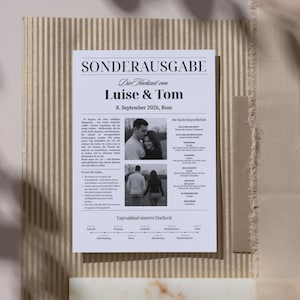 May include: A flat lay composition featuring a wedding invitation with the text "Sonderausgabe" and the names "Luise & Tom." The invitation includes photos and event details. Other elements include textured paper, a brown envelope, and a marble-like block.