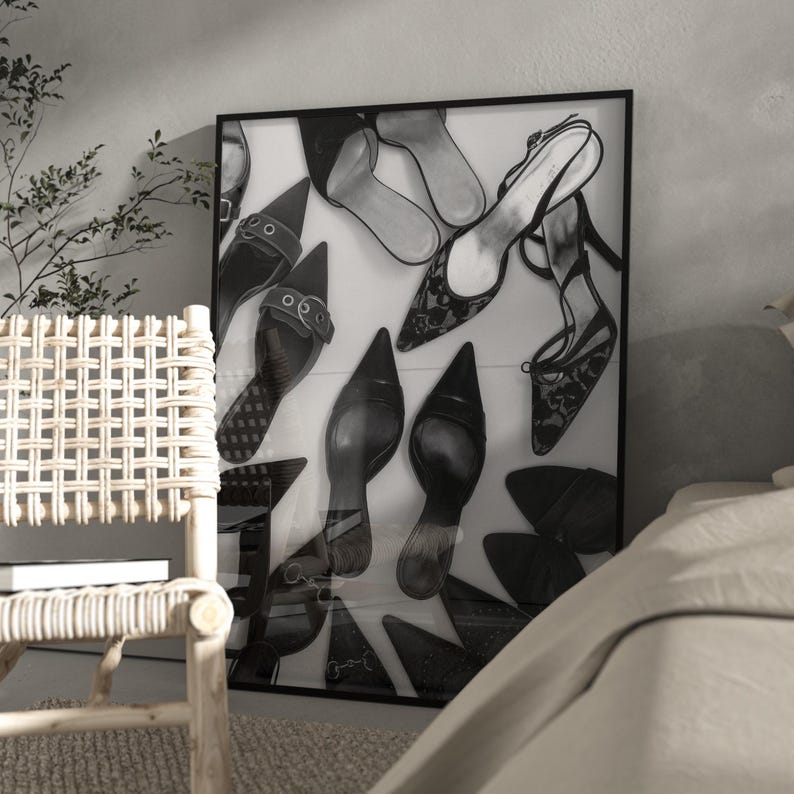 May include: Black and white framed art print featuring an assortment of high-heeled shoes. The artwork showcases various styles, including pointed-toe pumps, strappy sandals, and open-toe heels, creating a stylish and elegant composition.