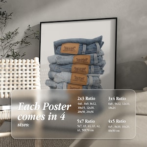 May include: A framed print showing a stack of folded blue denim jeans with brown leather patches. The print includes text indicating the poster comes in four sizes: 2x3, 3x4, 4x5, and 5x7 ratios.