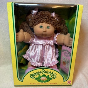 Vintage Hispanic Cabbage Patch Kids Doll Play Along Pink Dress NIB | Tan Skin Green Eyes Brown Yarn Hair | New In Box With Adoption Papers