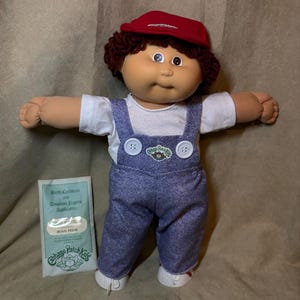 New from box-Vintage 1980s Coleco Cabbage Patch Kids Boy Doll – "Hugo Felix" with Birth Certificate