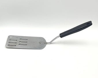 Vintage EKCO USA Spatule à fentes manche noir Turner offset en acier inoxydable