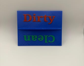 May include: A blue rectangular sign with the word "Dirty" in red letters above the word "Clean" in green letters. The sign is divided into two sections by a horizontal line.