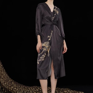 black dress eastern HANIYA This elegant black embroidered outfit reflects a perfect blend of sophistication and modern eastern fashion. The dress features a rich black base fabric beautifully decorated with delicate floral embroidery in soft