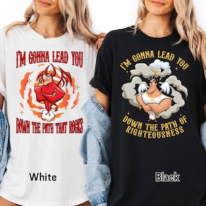 May include: White and black graphic t-shirts with the text "I'M GONNA LEAD YOU" and "DOWN THE PATH THAT ROCKS" and "DOWN THE PATH OF RIGHTEOUSNESS". The white shirt features a red devil graphic, while the black shirt has an angel graphic.