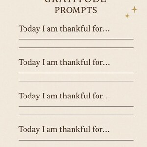 May include: A beige Holiday Gratitude Prompts page with text and decorative elements. The text reads "HOLIDAY GRATITUDE PROMPTS" and "Today I am thankful for..." with lines for writing. Gold star and leaf accents are included.