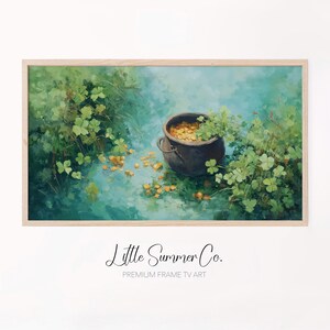 May include: A framed digital art print featuring a pot of gold, surrounded by green clovers. The artwork has a soft, painterly style with a teal and green color palette. The text "Little Summer Co." and "Premium Frame TV Art" is at the bottom.