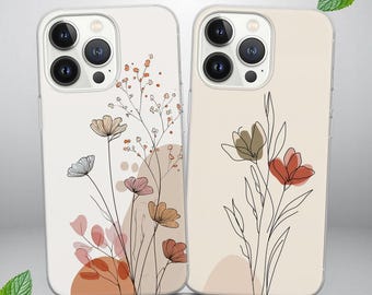 May include: Two phone cases with floral designs. One case has a white background with a design of flowers in shades of pink, orange, and beige. The other case has a beige background with a design of flowers in shades of brown and red.