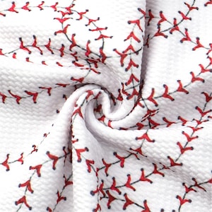 May include: White fabric with a red baseball stitch pattern. The fabric is textured and has a slightly wrinkled appearance.