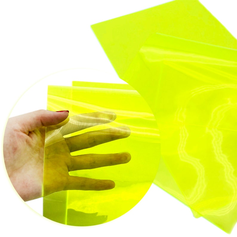 May include: A sheet of bright yellow translucent vinyl. The vinyl is flexible and can be used for a variety of craft projects.