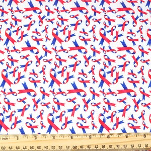 May include: White fabric with a repeating pattern of red and blue ribbon designs. The ribbons are arranged in a random pattern and are all facing the same direction.
