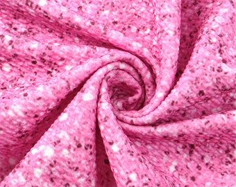 May include: Pink fabric with a white and pink speckled pattern. The fabric is textured and has a soft, crinkled look.