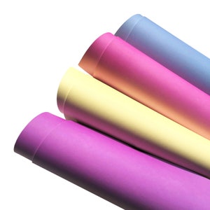 May include: Four rolls of pastel colored craft paper. The colors are light purple, yellow, pink, and light blue.