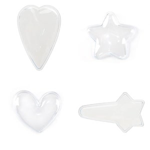 May include: Four clear plastic shapes: a heart, a star, a heart, and a shooting star. The shapes are all transparent and have a smooth, glossy finish.