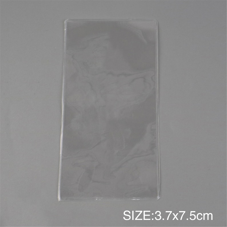 May include: Clear plastic sleeve, 3.7 x 7.5 inches in size.