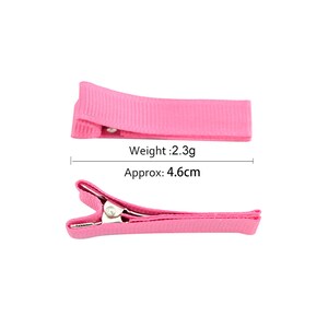 May include: Pink hair clip with a metal clasp. The clip is approximately 4.6 cm long and weighs 2.3 grams.