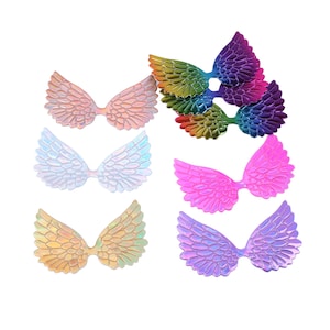 May include: Assortment of iridescent angel wings in various colors, including pink, purple, gold, and white. The wings are made of a shiny, reflective material and are perfect for adding a touch of whimsy to crafts and decorations.