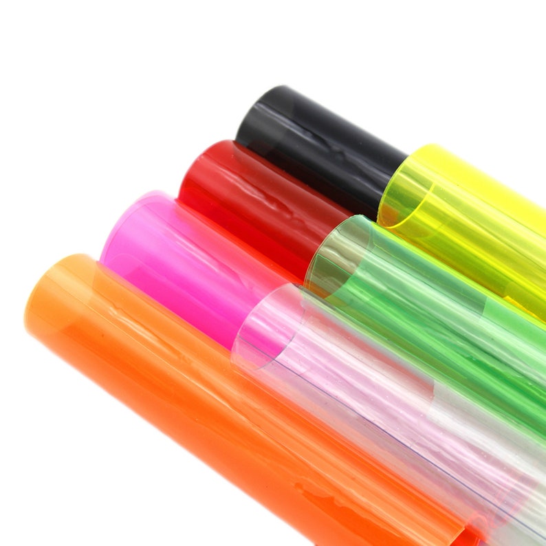 May include: A set of six colorful transparent plastic sheets, including orange, pink, light purple, green, yellow, and black.