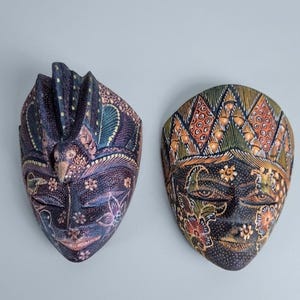 May include: A white-painted wooden 'Welcome' sign with a distressed finish and a heart detail. The sign, suitable for indoor or outdoor use, features the word 'Welcome' in a whimsical font.