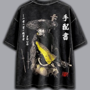 May include: Black graphic t-shirt with a samurai warrior illustration, complete with a straw hat and swords. Japanese text and a red seal are incorporated into the design. The shirt has a vintage, distressed appearance.