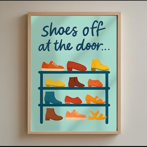 May include: A framed print featuring the text "shoes off at the door..." above a shoe rack illustration. The rack displays various colourful shoes, including boots, heels, and trainers, in shades of orange, yellow, red, and blue. The background is a light teal colour.