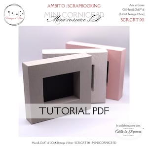 Può includere: Tre mini cornici rettangolari in tonalità neutre. La cornice anteriore è grigio chiaro con una superficie strutturata, la cornice centrale è bianca e la cornice posteriore è rosa. Le cornici hanno un'apertura quadrata al centro. Il testo "TUTORIAL PDF" è visualizzato sulla cornice anteriore.