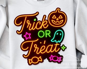 May include: White sweatshirt with a neon-style "Trick or Treat" design. The design includes a jack-o'-lantern, ghost, star, and candy graphics in orange, green, pink, and teal. The sweatshirt has a crew neck and long sleeves.