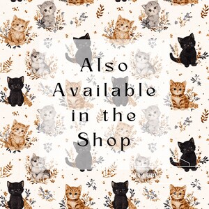 May include: A repeating pattern of various cat illustrations in black, gray, and orange, surrounded by floral accents, on a cream background. The text "Also Available in the Shop" is centered in black.