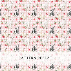 May include: A repeating pattern featuring white and black goats, strawberries, and floral elements on a pink gingham background. The text "PATTERN REPEAT" is displayed at the bottom of the image. This design is suitable for fabric or wallpaper.