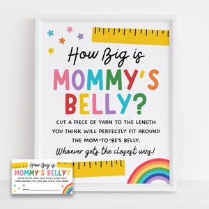 Op de afbeelding: Een ingelijst bord en bijpassende kaart voor een babyshower-spel. Het bord leest "How Big is Mommy's Belly?" in kleurrijke letters, met instructies en een regenboogafbeelding. Er is ook een gele liniaalafbeelding.
