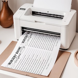 May include: A white printer is printing a black and white nursery rhyme quiz on a sheet of paper. The quiz sheet is on top of a brown paper envelope. The quiz includes questions about nursery rhymes.