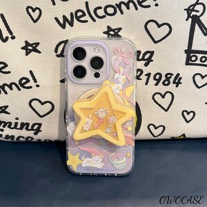 May include: A clear phone case with a playful design, including cartoon characters, stars, and a yellow star-shaped phone grip. The case has a purple border and the text "welcome" and "me!" on the background.