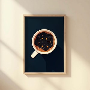 May include: A framed art print featuring a coffee cup with a dark, starry liquid inside. The cup is white with a brown rim and handle, set against a dark blue background. The artwork has a minimalist, whimsical style.