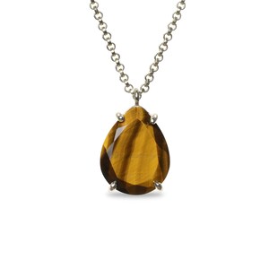 May include: A silver chain necklace with a teardrop-shaped tiger's eye gemstone pendant.