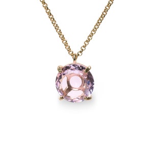 May include: A delicate gold chain necklace with a round, light purple amethyst gemstone pendant.