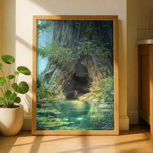 May include: A framed art print depicts a serene forest scene. A brown bear sits in a pond in front of a large tree with a cave. The water is green with lily pads. The print is in a light brown wooden frame.