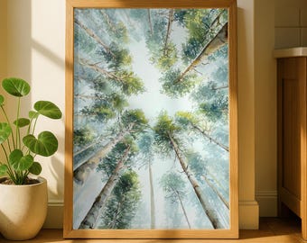 May include: A framed watercolor print of tall trees reaching towards the sky. The artwork features a perspective view looking up through the forest canopy, with green and blue hues dominating the scene. The frame is made of light-colored wood.