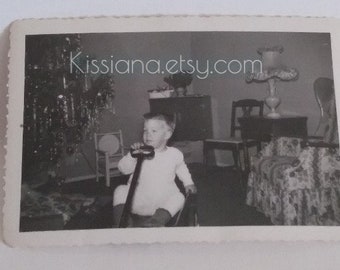 Little boy enjoying his little red wagon he got for Christmas--Vintage B&W photo