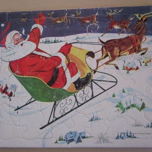 Puzzle vintage di Babbo Natale e renne.