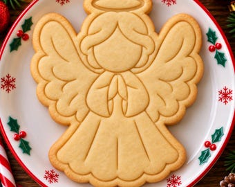Set di formine e stampini per biscotti a forma di angelo natalizio, strumento per la pasticceria durante le feste.