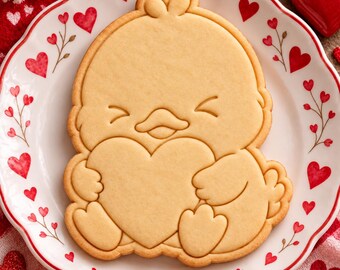 Tagliabiscotti e stampino per biscotti a forma di pulcino di San Valentino, pulcino che tiene in mano un cuore