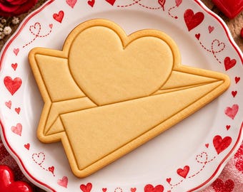 Tagliabiscotti e timbro a rilievo con lettere d'amore, timbro a forma di aeroplanino di carta a forma di cuore per San Valentino