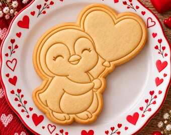 Tagliabiscotti e timbro a forma di pinguino, timbro a forma di palloncino a forma di cuore per San Valentino
