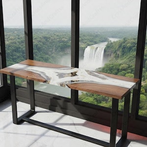 May include: A wooden console table with a white and gold resin river design. The table has a dark brown wood finish and black metal legs. The table is approximately 122 cm long and 41 cm wide.