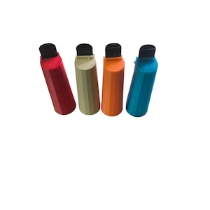 May include: Four colorful, plastic bag clips in red, tan, orange, and teal. Each clip has a black top and a ridged, geometric design. These clips are designed to seal bags and keep contents fresh.