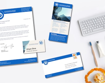 May include: A business stationery set featuring a letterhead, business card, brochure, and envelope, all with a blue and white design. A keyboard, pencils, and other office supplies are also present.