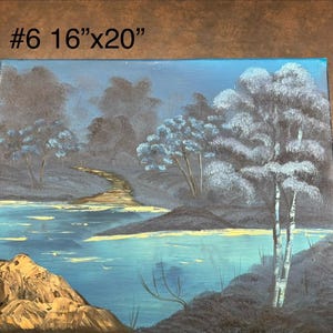 May include: A landscape painting depicting a serene scene with a river, trees, and a path. The artwork, measuring 16" x 20", features a color palette of blues, grays, and touches of gold. The painting showcases a tranquil natural environment.