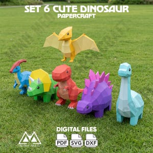 May include: A set of six low-poly papercraft dinosaur figures in yellow, blue, green, red, purple, and light blue. The text SET 6 CUTE DINOSAUR PAPERCRAFT and DIGITAL FILES PDF SVG DXF is visible. The figures feature geometric, faceted designs.