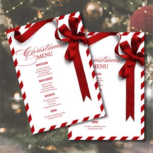 May include: Two Christmas menus with red and white striped borders and a red ribbon bow. The menus list appetizers, main courses, desserts, and drinks. The text "Christmas Menu" is at the top of the menu.