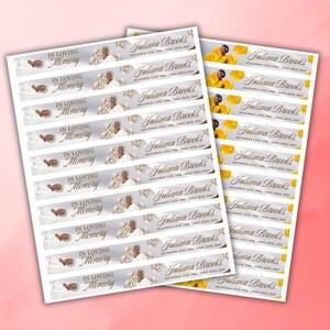 May include: Sheets of memorial stickers with the text "In Loving Memory" and "Juliana Brooks" with dates. The stickers feature a photo, floral accents, and a soft color palette of white, gray, and gold.